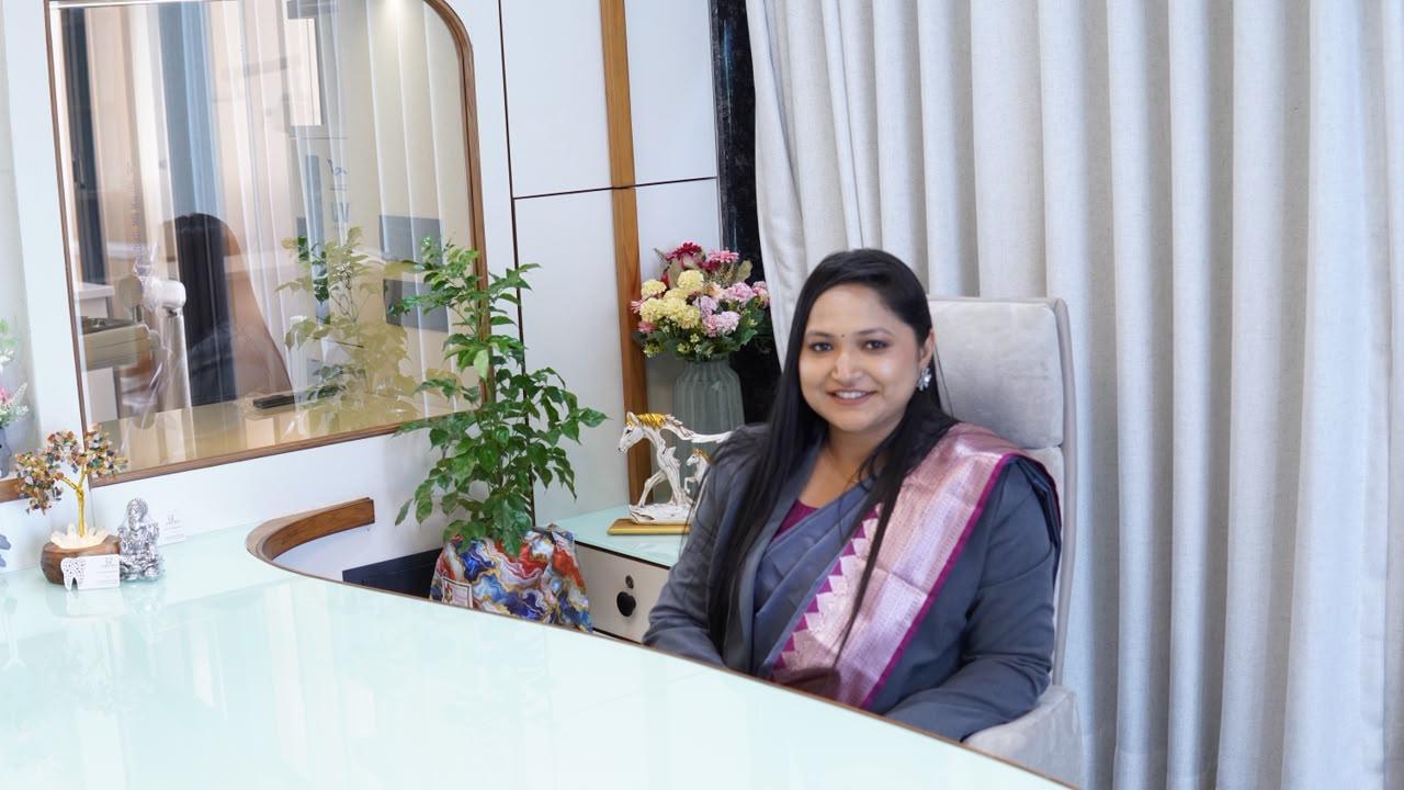 Dr. Krishna Kotadiya Shah at the consultation desk at Aroma Dental Clinic
